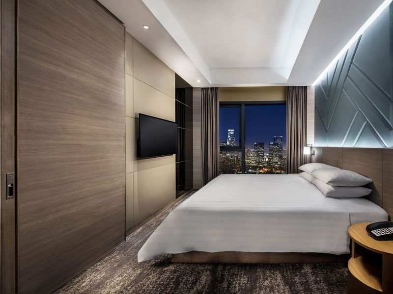 King-size bed and sitting area in Premier Room at Sunway Velocity Hotel