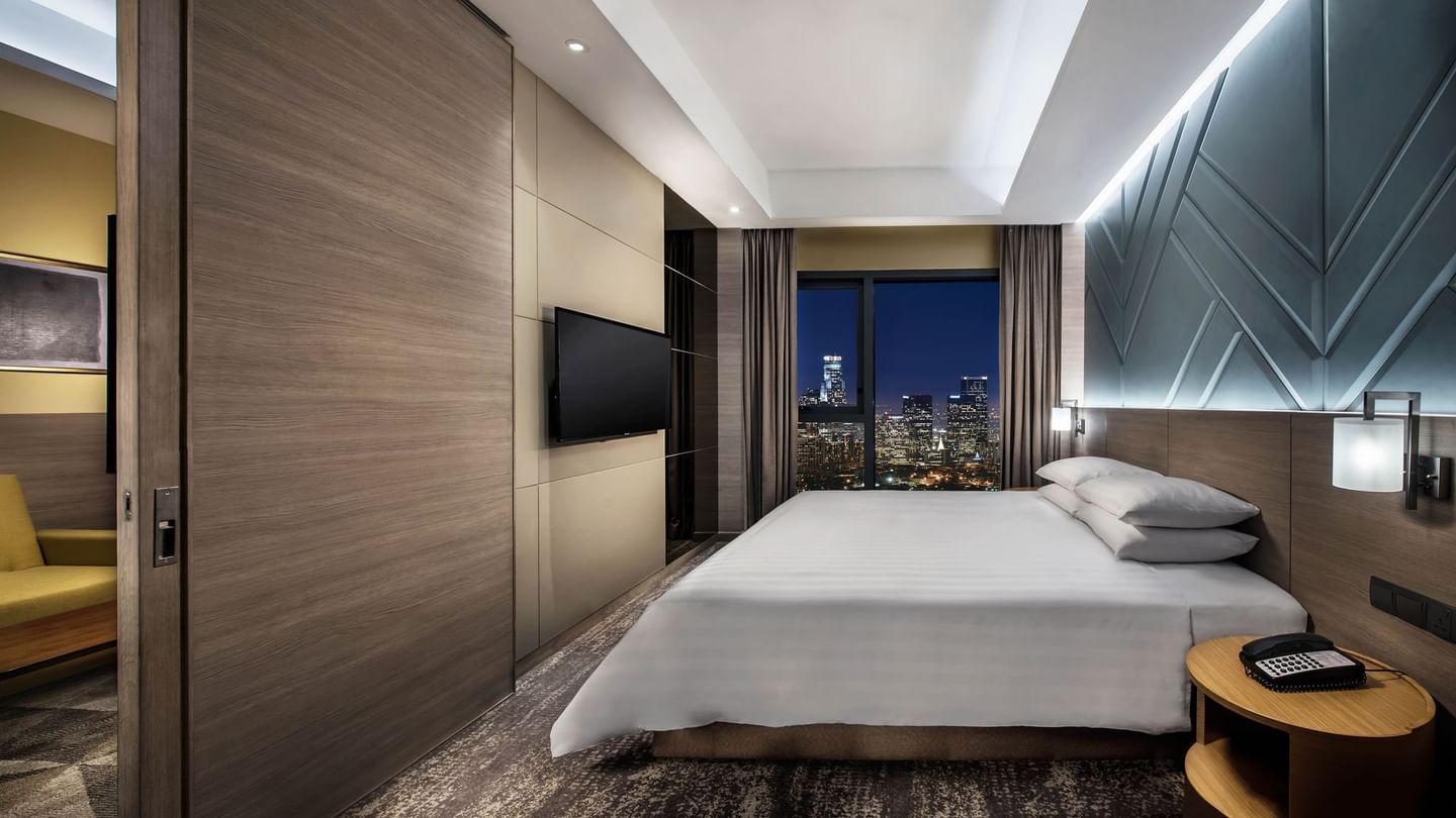 King-size bed and sitting area in Premier Room at Sunway Velocity Hotel