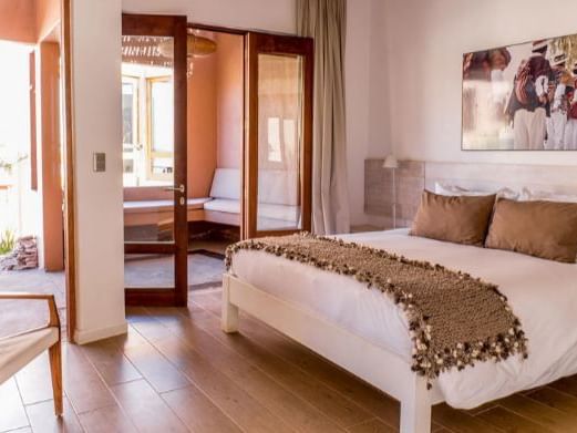 hotel room with king size bed at NOI Casa Atacama Hotel  