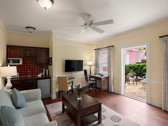 Living area arranged with the sofa and a TV at  Royal Palms Hotel