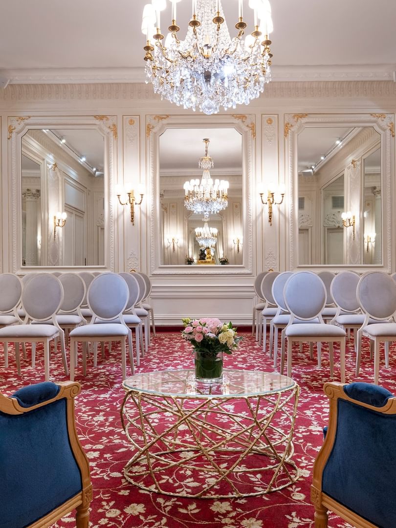 Armchair with a glass coffee table facing the theater set up in Capucines Meeting Room at Hotel Westminster Paris