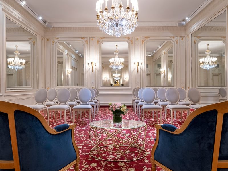 Armchair with a glass coffee table facing the theater set up in Capucines Meeting Room at Hotel Westminster Paris