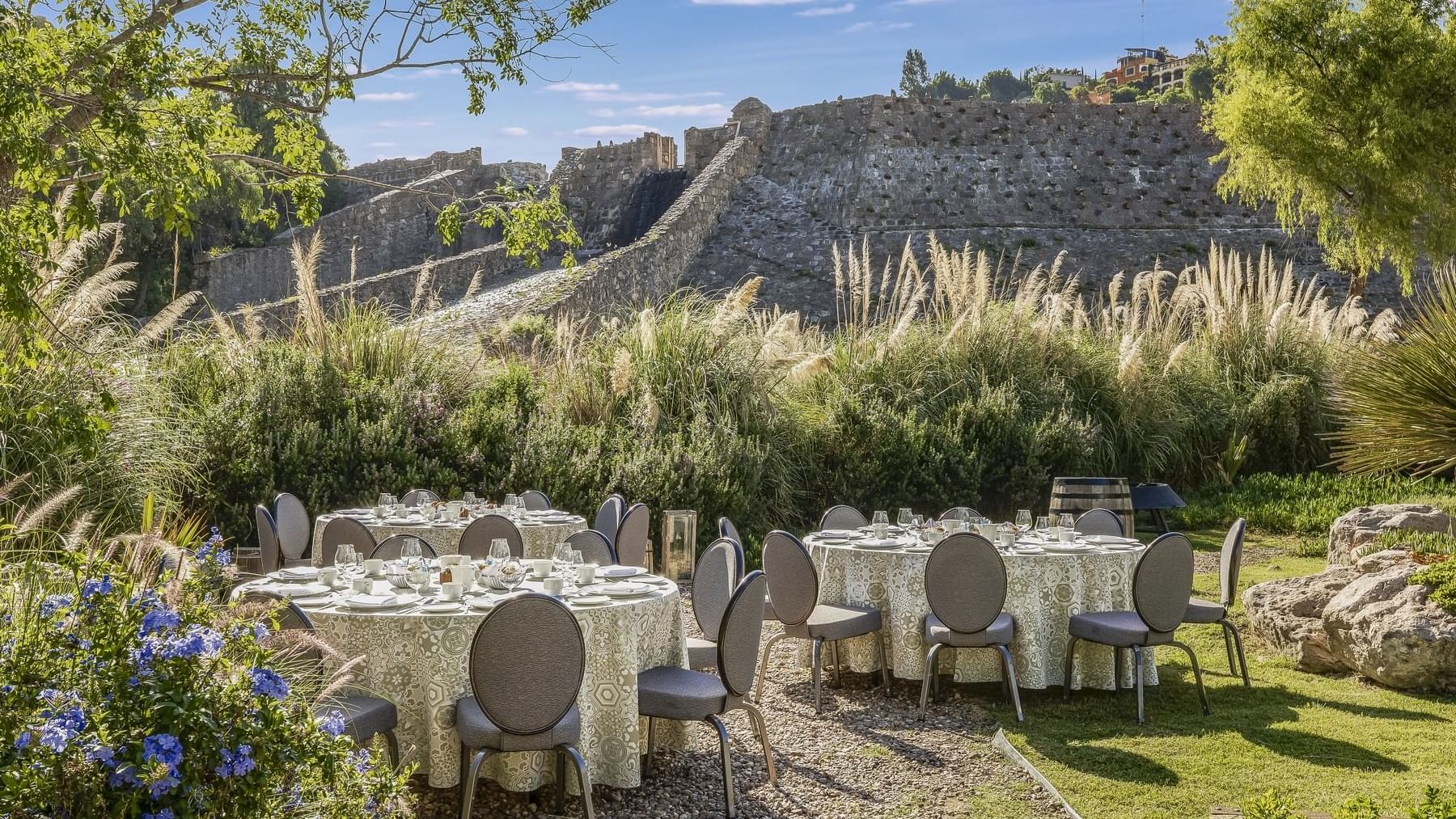 Outdoor banquet dining set-up with glassware at Live Aqua San Miguel de Allende