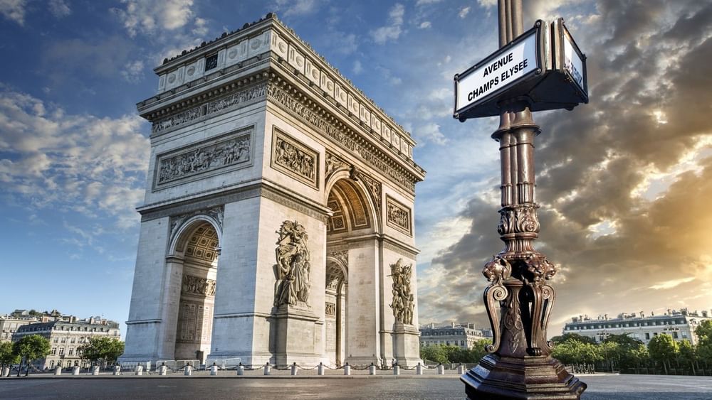 The Arc de Triomphe in Paris, framed by a vintage 