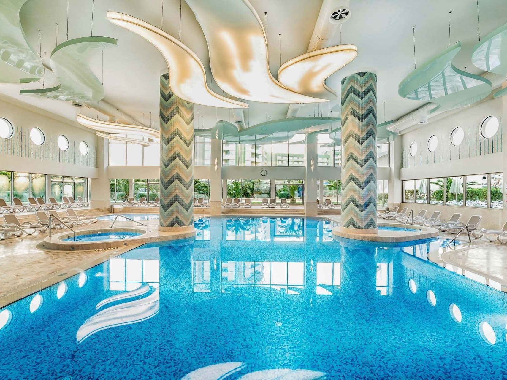 Interior of an elegant marble glazed indoor Pool at Titanic Deluxe Lara