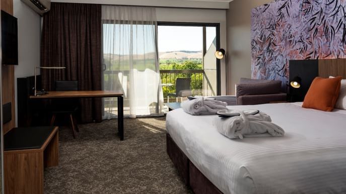 Interior of Comfy bedroom with a balcony at Novotel Barossa