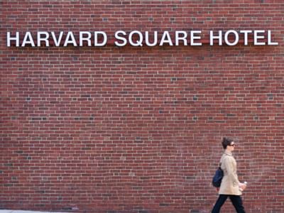 sign that says harvard square hotel