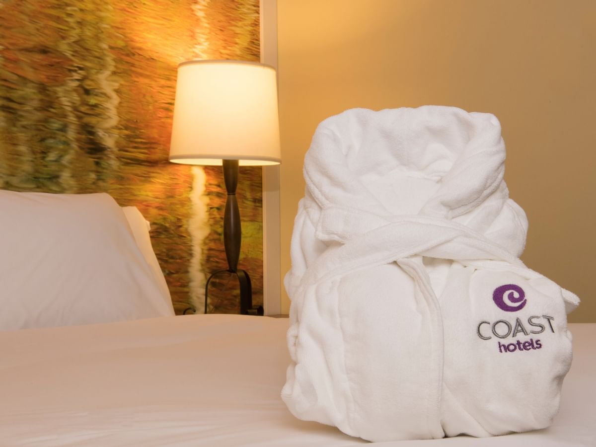Robe on bed in hotel room