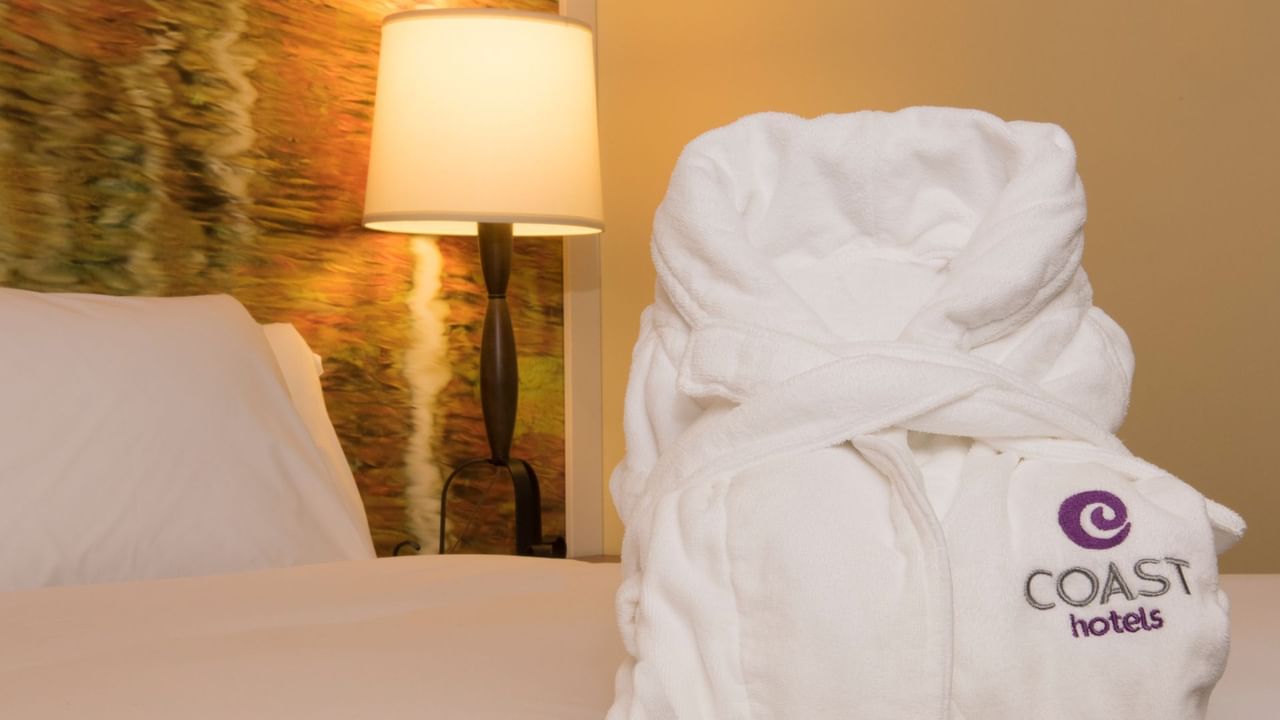 Robe on bed in hotel room