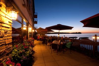 Outdoor dining by lake view from the Chase on The Lake at night