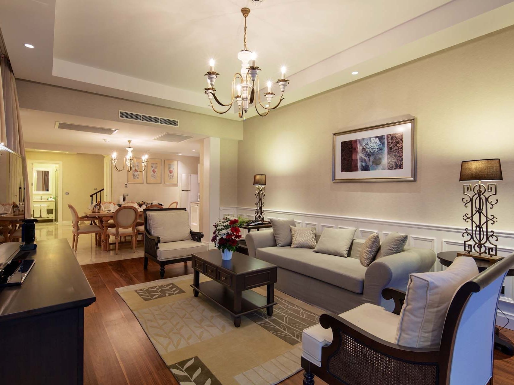 TV lounge area of Exclusive Pool Villa with wooden floors at Titanic Deluxe Golf Belek