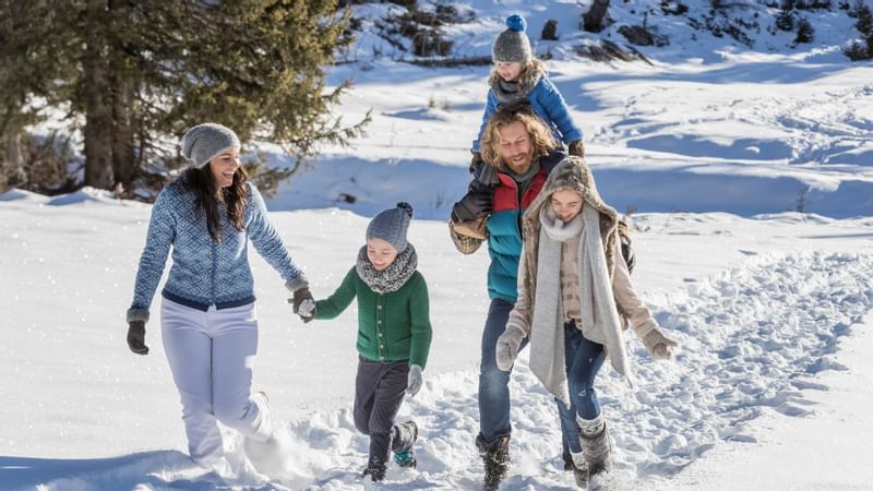 Family enjoying on the snow, Falkensteiner Hotels & Residences