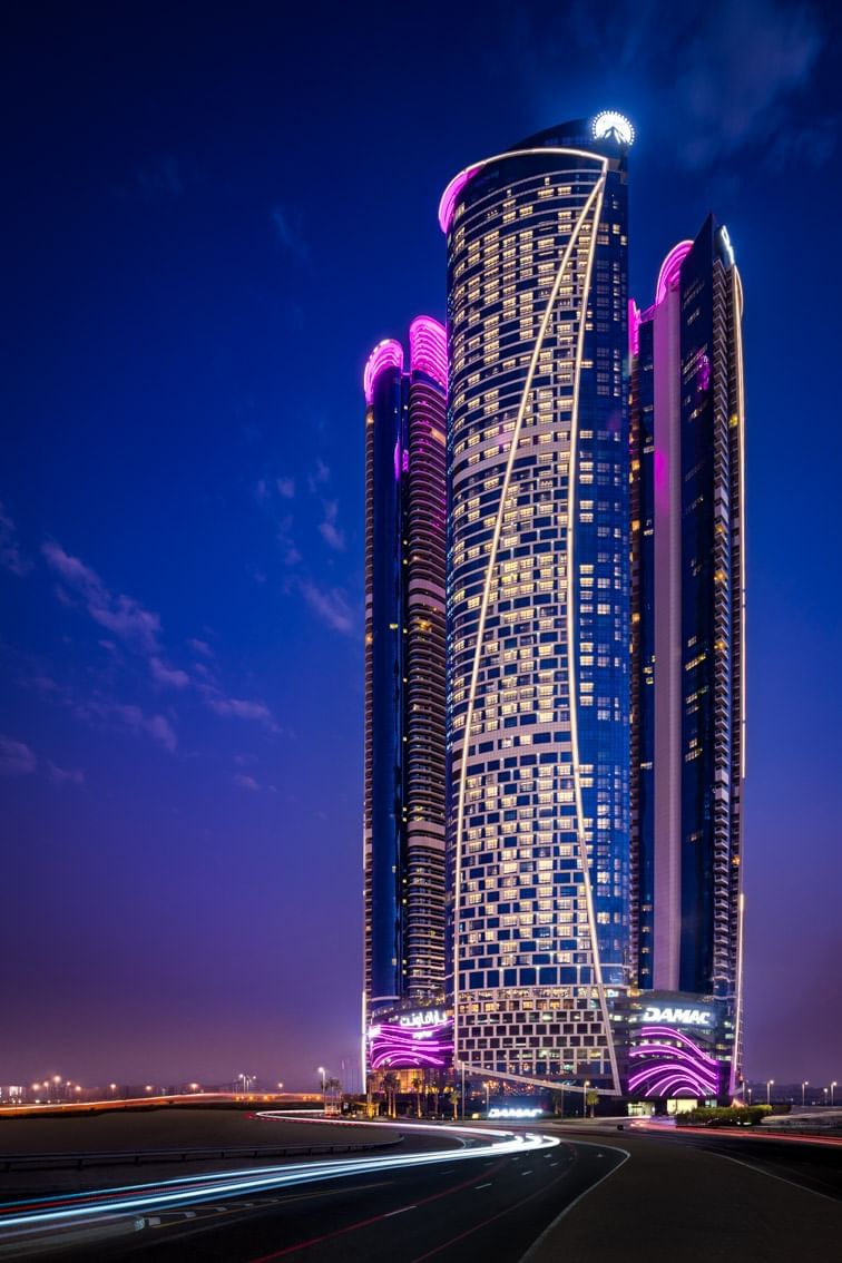 Low-angle exterior view of Paramount Hotel Dubai at night