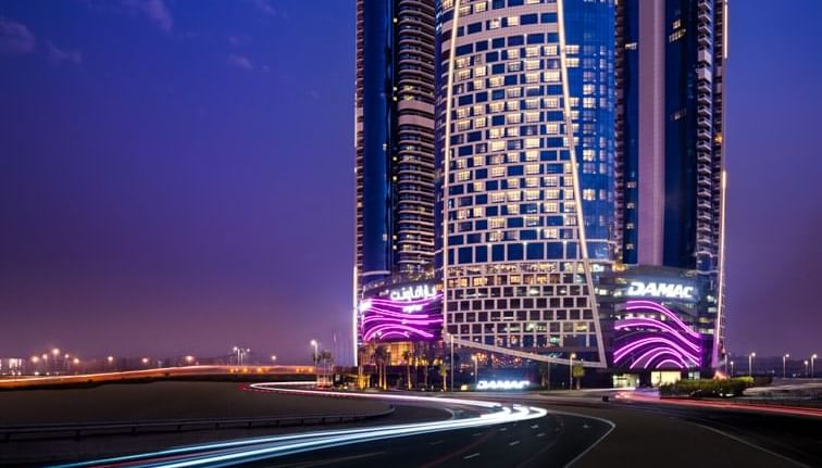Low-angle exterior view of Paramount Hotel Dubai at night