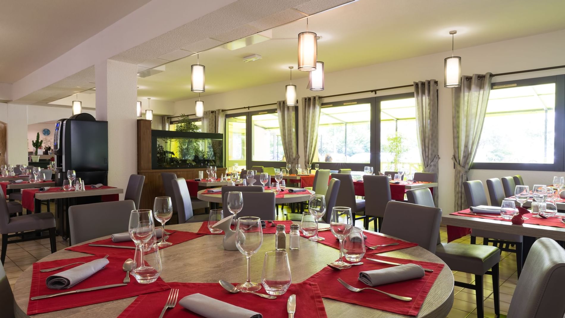 Chairs & tables with cutlery, glasses at The Originals Hotels