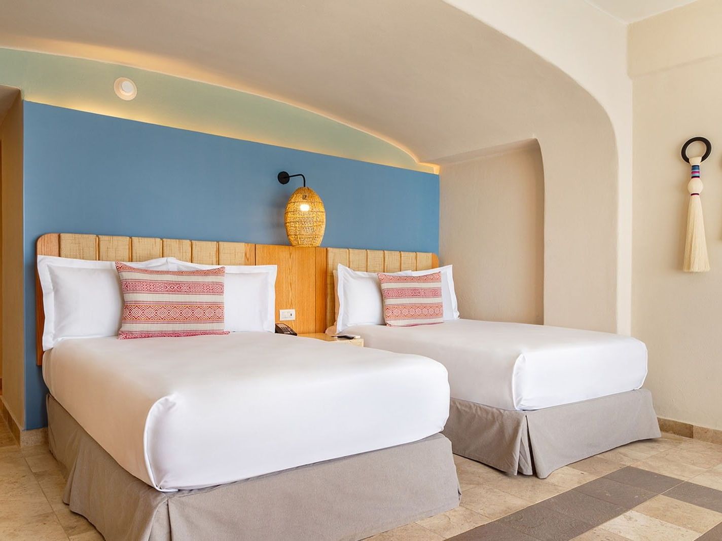 Ocean View 2 Double Deluxe Superior with cozy beds, blue accent wall & woven pendant lamps at Camino Real Acapulco Diamante