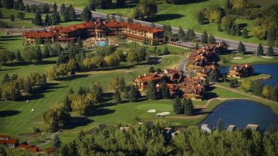 Aerial view of a Hotel Park City Autograph Collection with a pool nestled in greenery