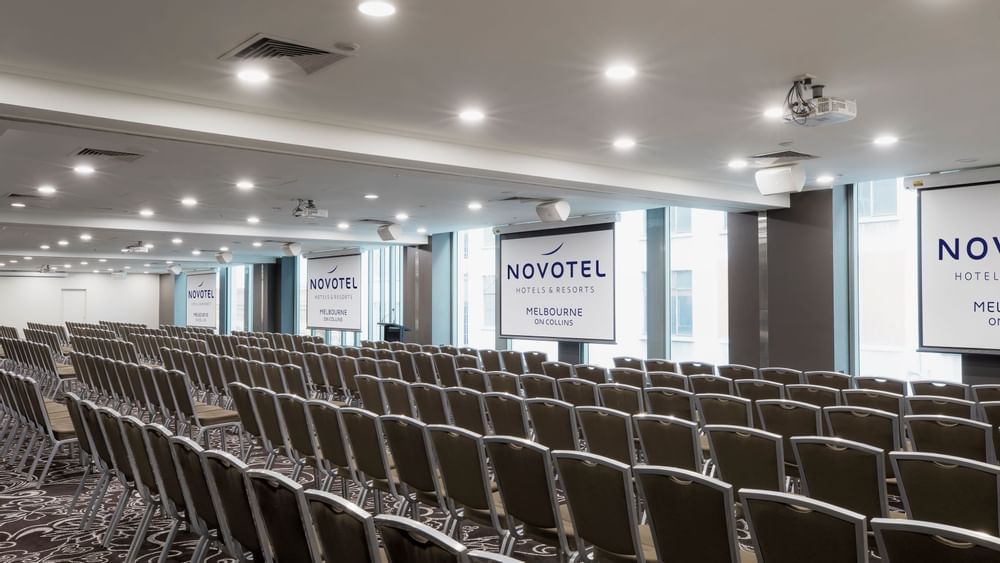 Chairs setup for a conference in Novotel Melbourne