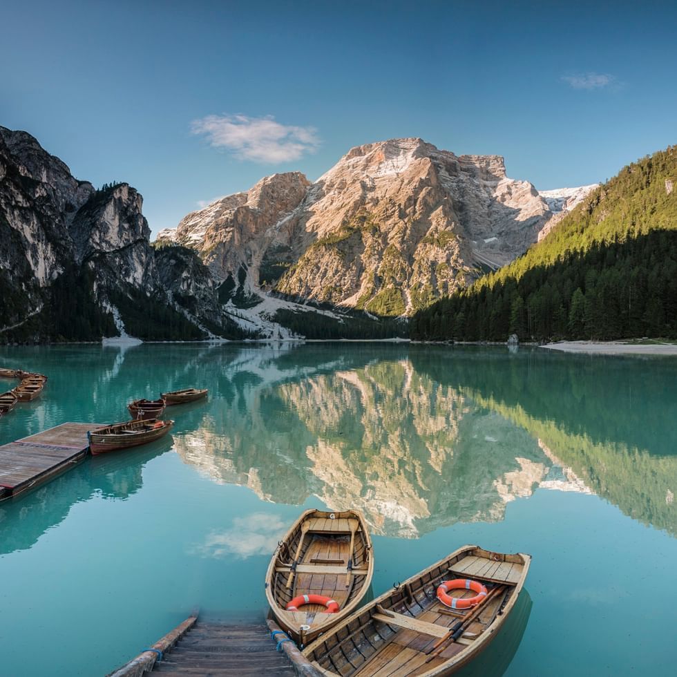 Boats in a mountain lake in Prags near Falkensteiner Hotels