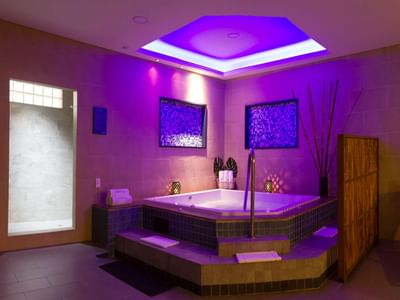 Luxurious jacuzzi with ambient lighting and a tranquil, relaxing atmosphere in Prime Spa at Habitel Prime Hotel