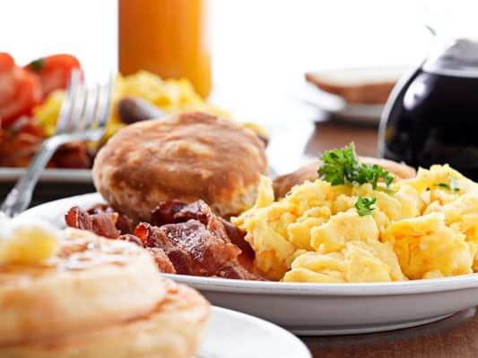 Closeup of served breakfast with scrambled eggs at Peaks Resort