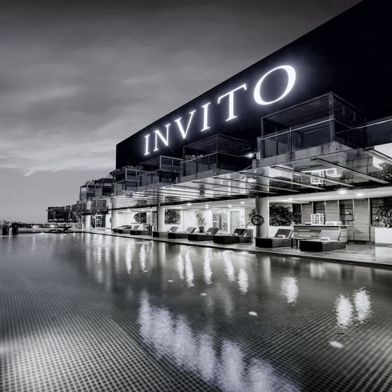Exterior view of Invito hotel by pool at VE Hotel & Residence