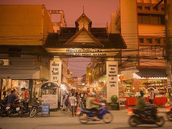 Crowded Chiang Rai Night Bazaar near Hop Inn Hotel