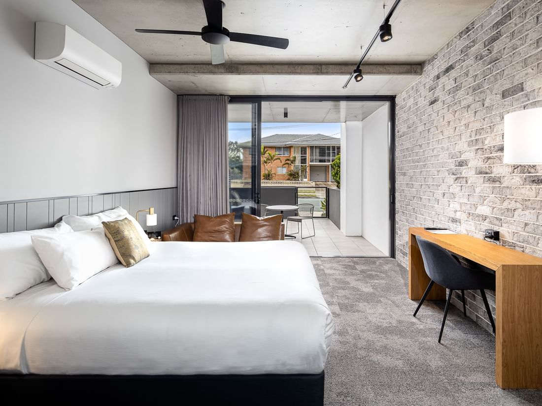 classic room bed and balcony view 