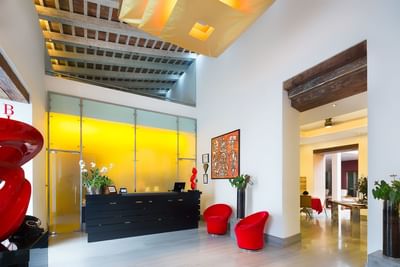 Lobby of Billini Hotel Historic Luxury featuring a striking glass wall & reception desk at Billini Hotel Historic Luxury