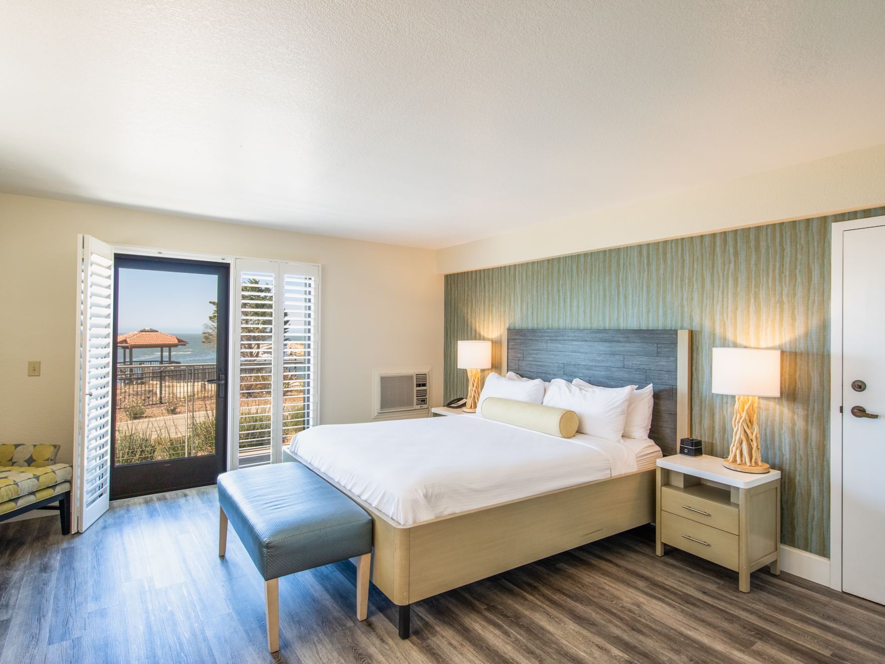Oceanfront King room with bed and outside access