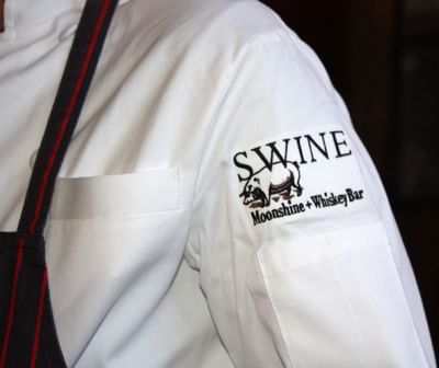 A chef at Swine Restaurant in Paramount Hotel Portland