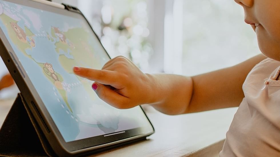 A Child looking at the world map - Legacy Vacation Resorts