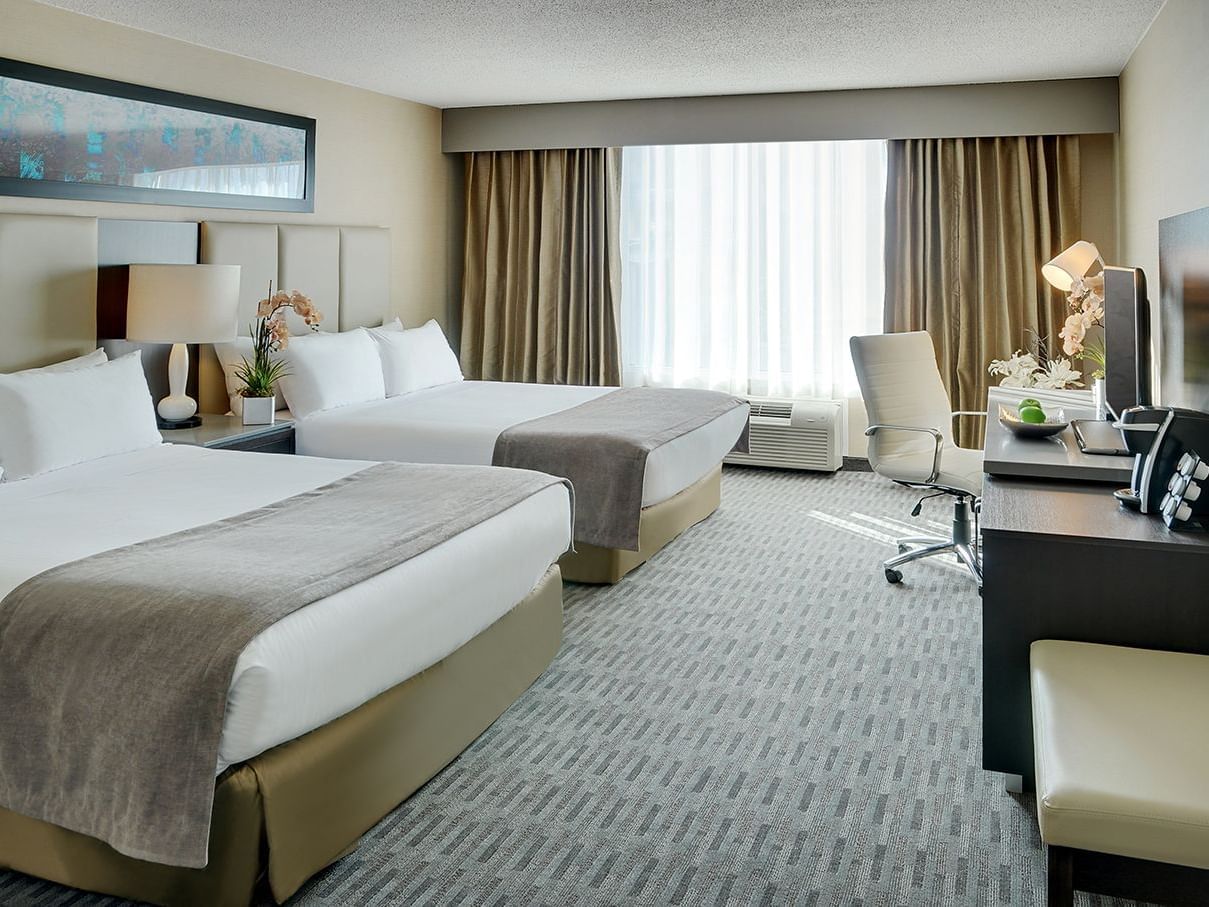 two beds in a hotel suite
