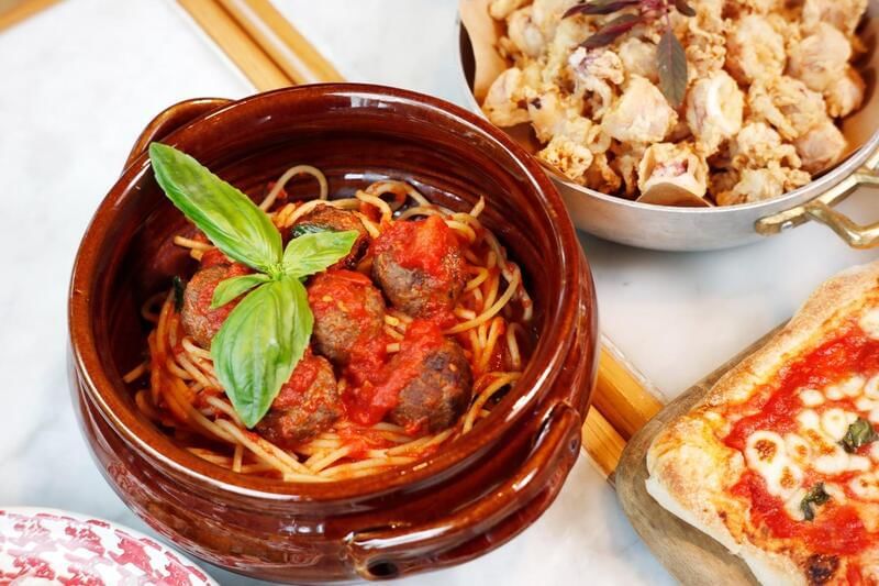 Bowl of spaghetti topped with meatballs and basil at the family dinner in Park Hyatt Saigon