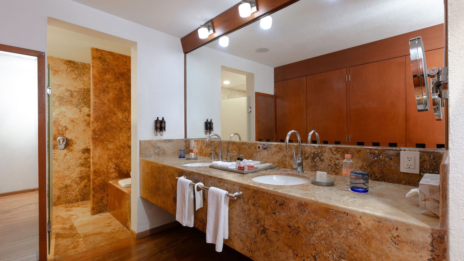 King Presidential Suite bathroom with two sinks and a shower at Camino Real Guadalajara in Zapopan