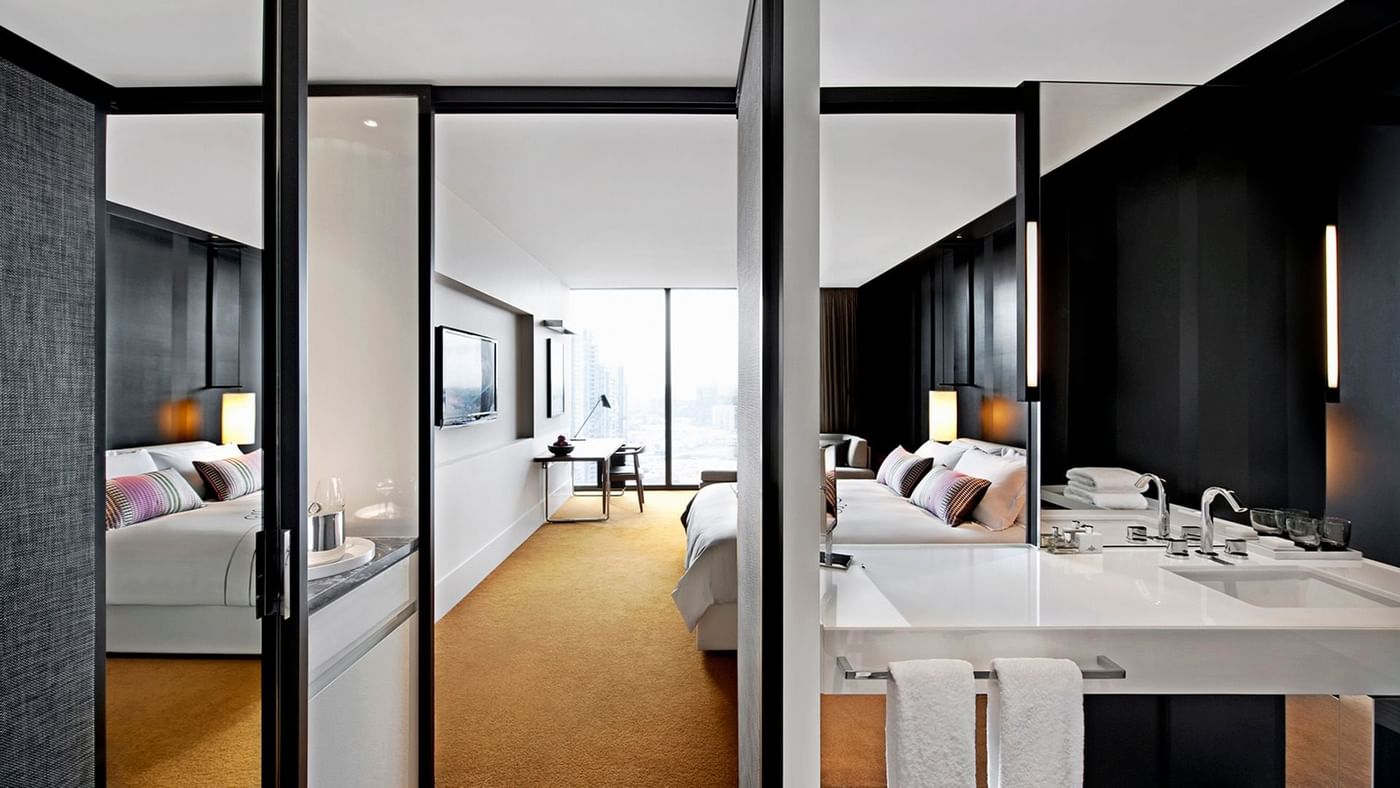 Interior of Func Room Loft bathroom vanity area overlooking the city at Crown Hotels