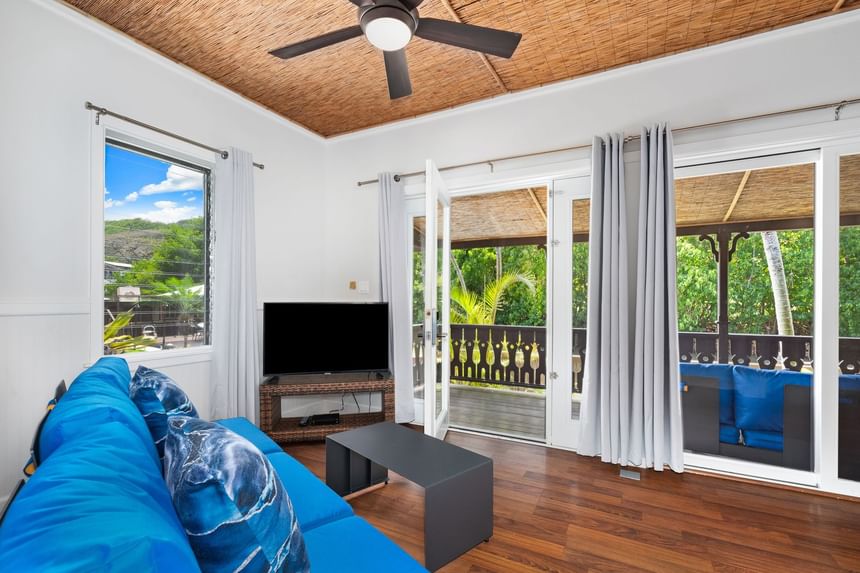 Livingroom with a picture window & balcony in Two-Bedroom at Paradise Bay Resort