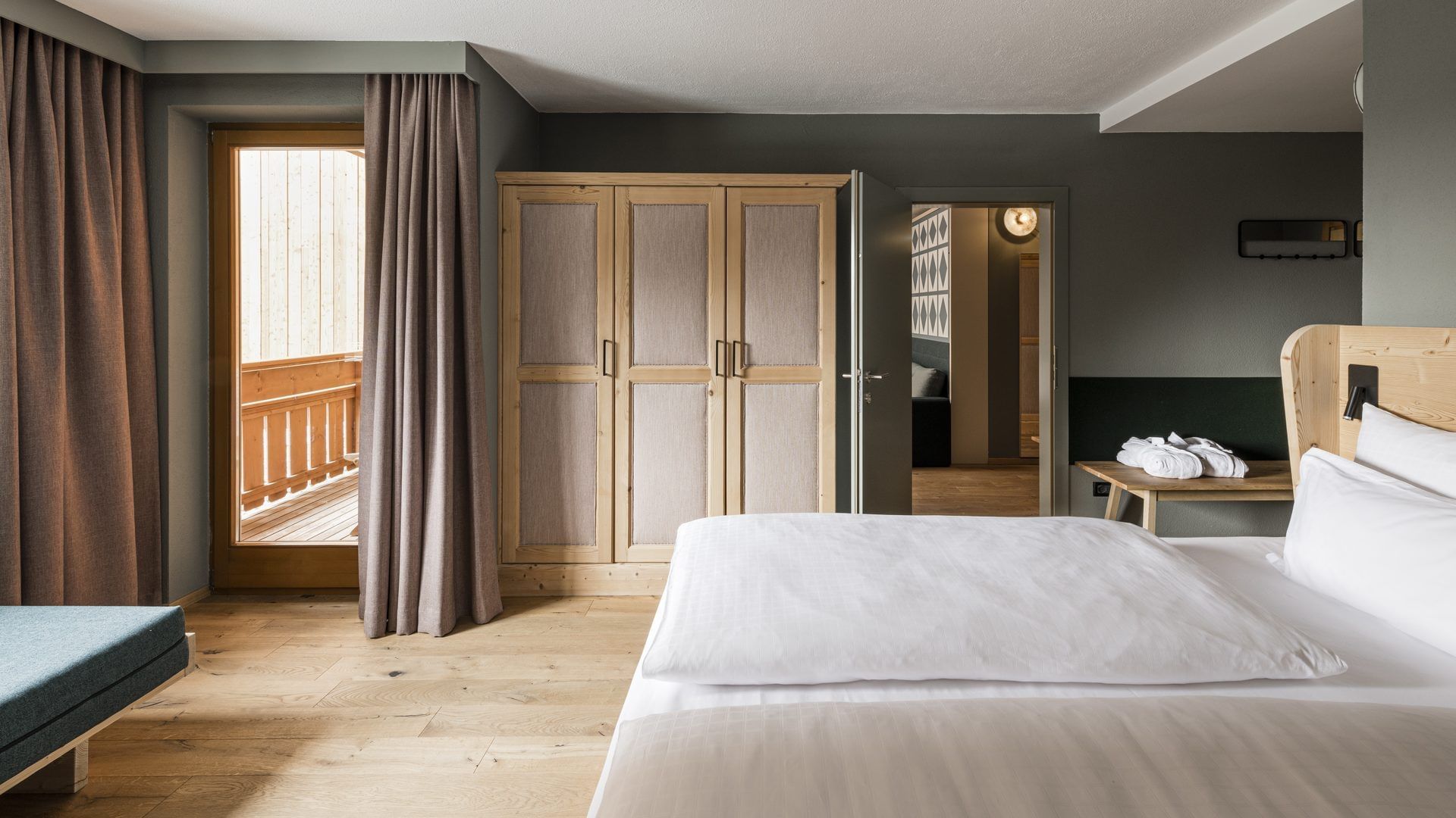Bed & Closet in Suite Valley View at Falkensteiner Hotels