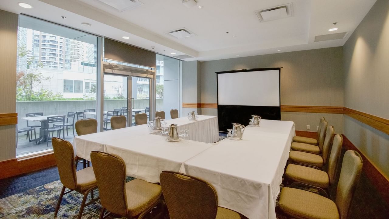 Meeting room with chairs, tables and projector