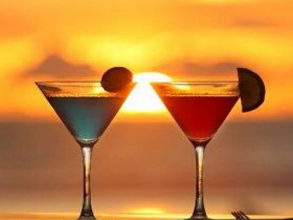 Two cocktails at Sunset Bar at Accra Hotels during the sunset