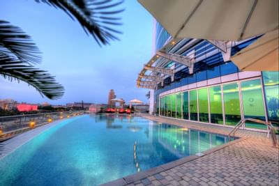 View of the outdoor swimming pool at Tamani Marina Hotel