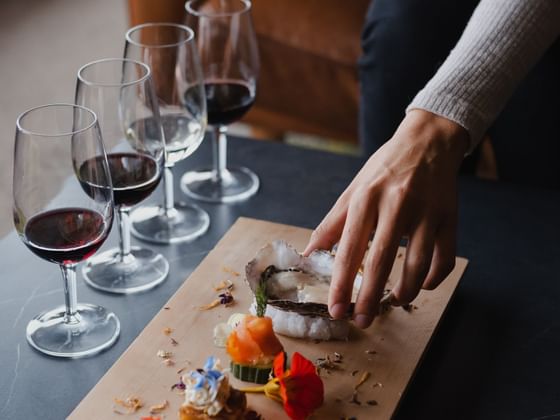 Close-up of lined wine glasses on a table at Freycinet Lodge