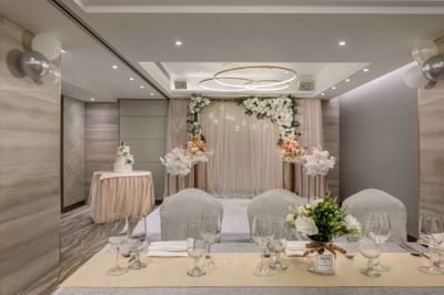 Wedding ceremony arranged with flowers & tables indoors at Park Hotel Hong Kong