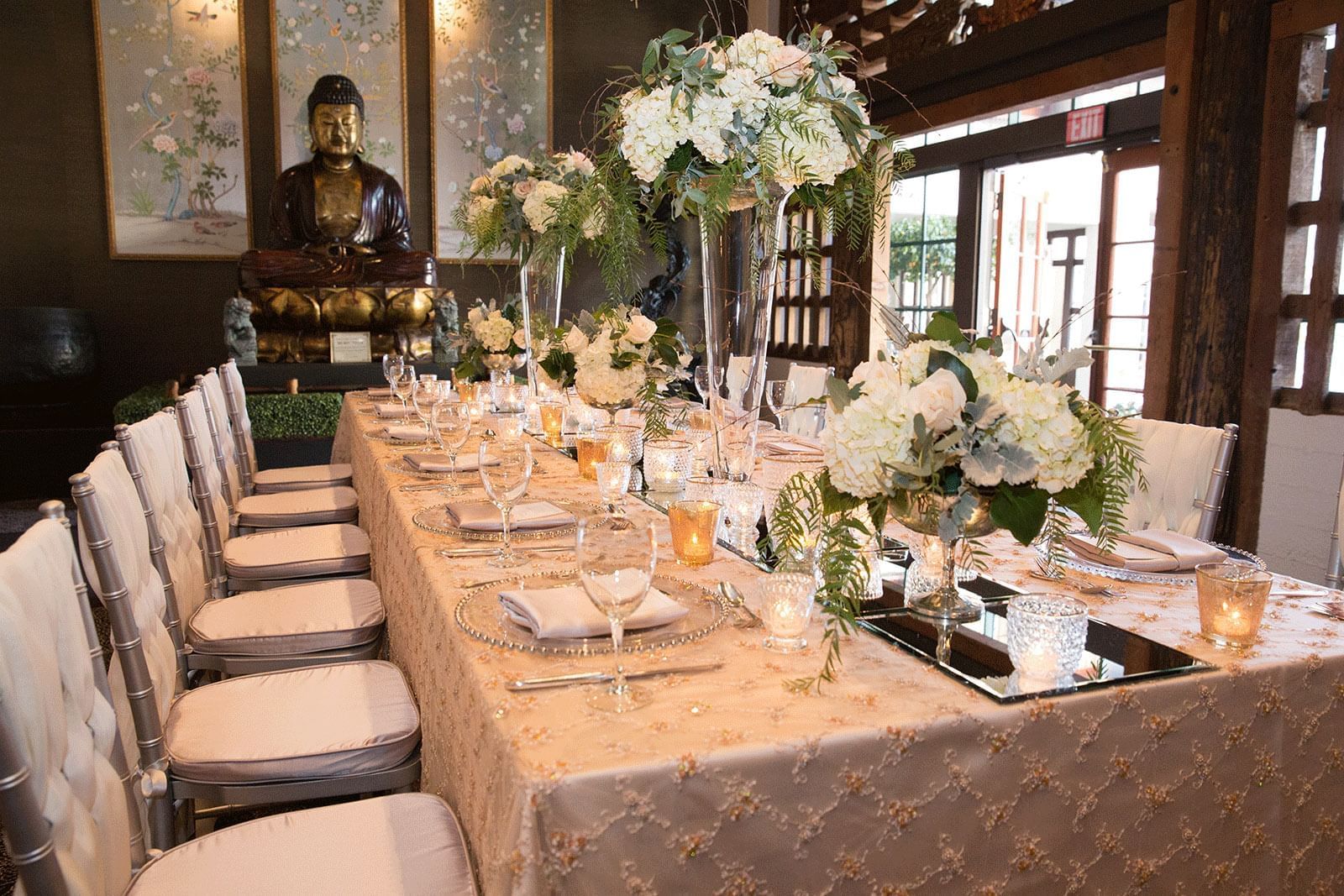 banquet room with decorated table and flowers