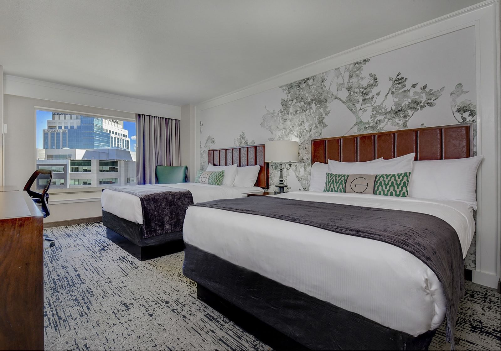Two queen beds in Two Queen Deluxe bedroom at The Grove Hotel