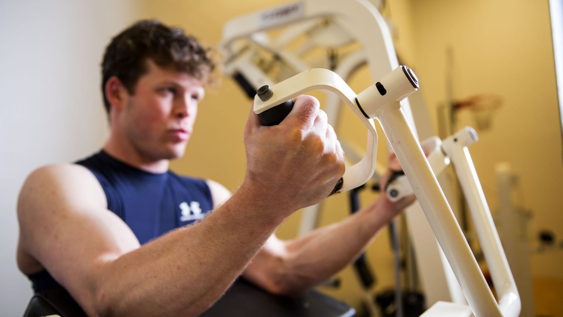 Man working out with the fitness equipment in the Gym at Cove Pocono Resorts