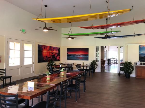 Dining table at restaurant with surfboard decorations