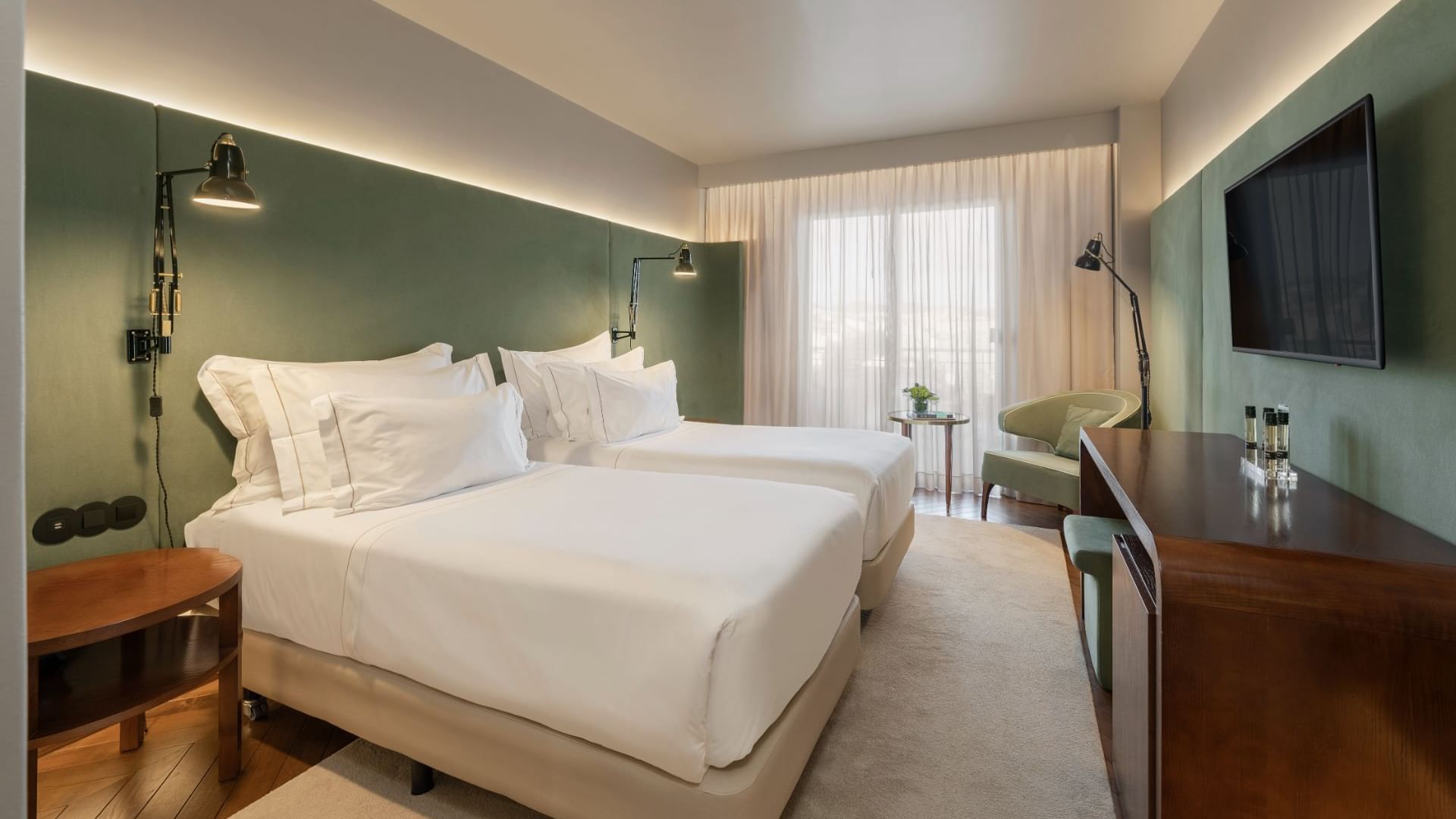 Two large beds in a city view room at Bensaude Hotels
