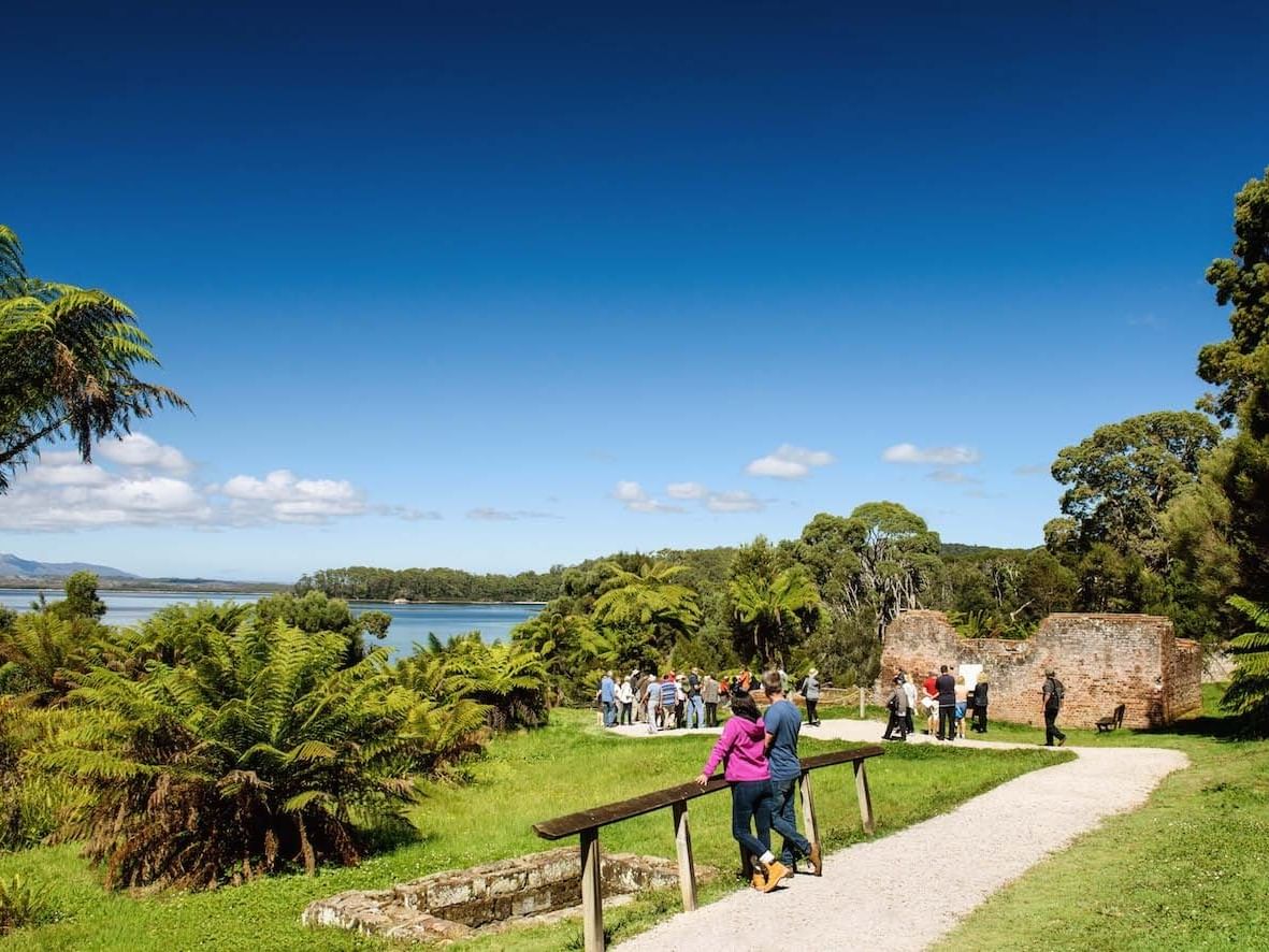 A Couple enjoying the view of Sarah Island near Strahan Village