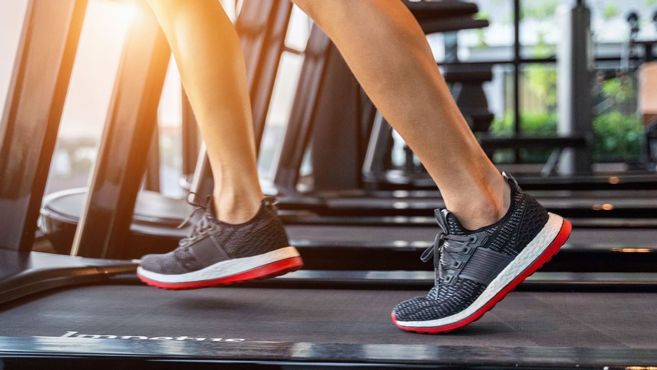 Runner's feet on a treadmill at Coast Grimshaw Hotel & Suites